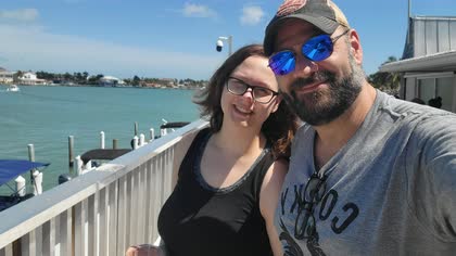 Scott with his daughter Cali by the water