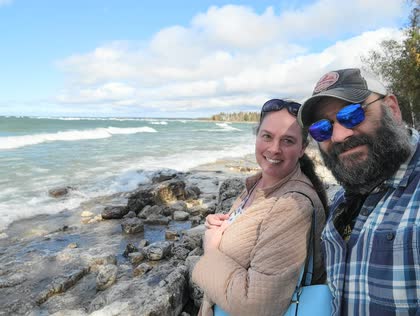 Scott and his wife Gerrie on a rocky Lake Michigan shore